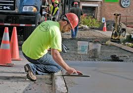 Worker smoothing out concrete